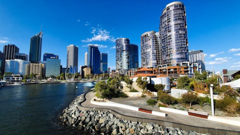 city skyline near body of water during daytime